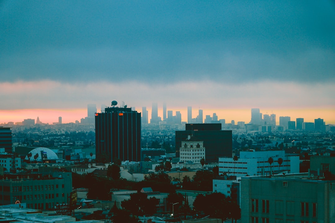 high-rise and mid-rise buildings, Los Angeles below the clouds<p></figure>