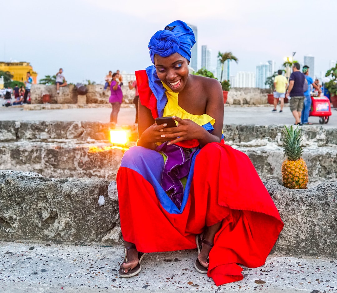 woman wearing yellow and red dress,