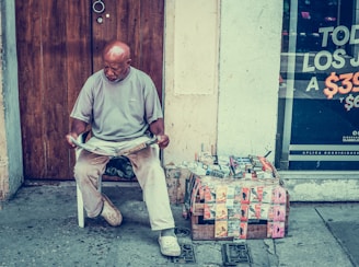 man reading newspaper near door