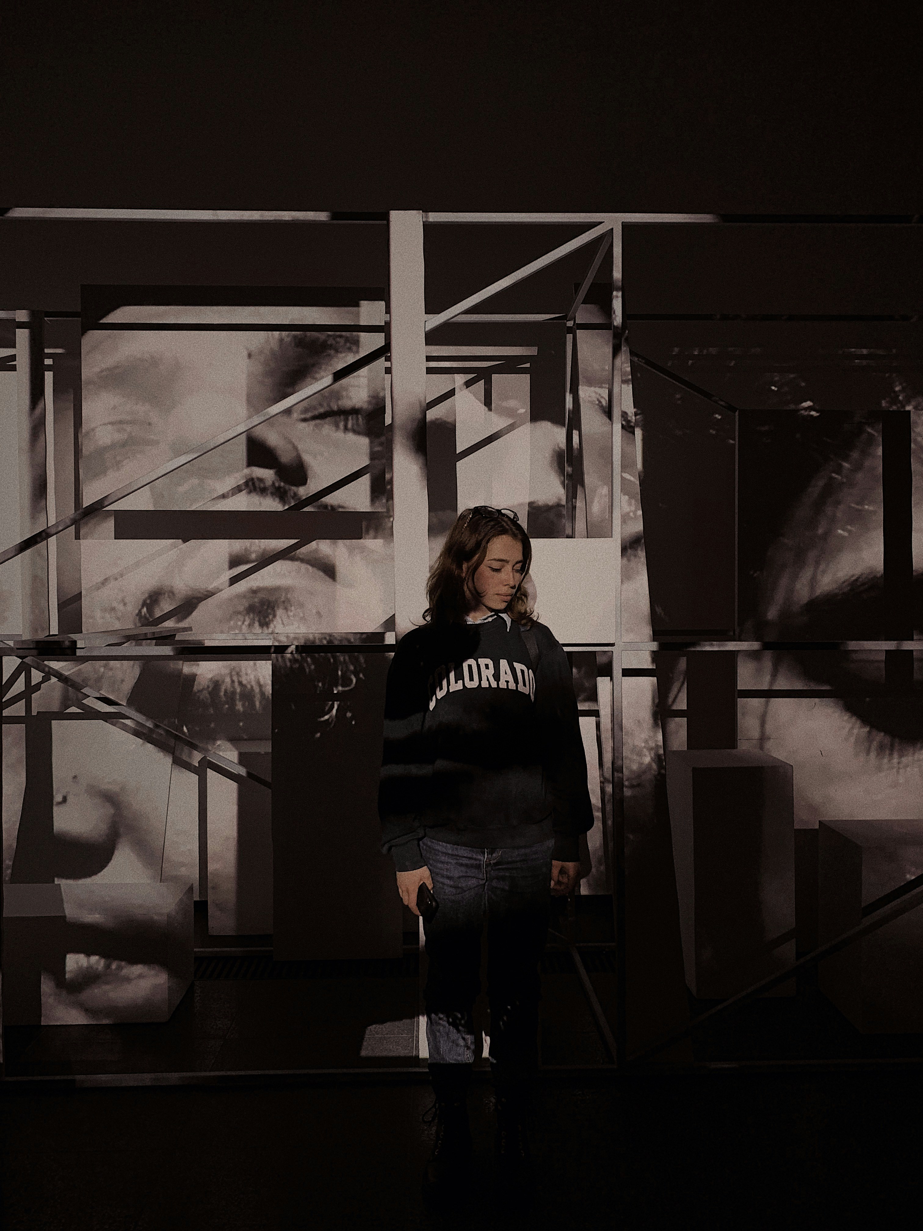 woman standing in front on white wall