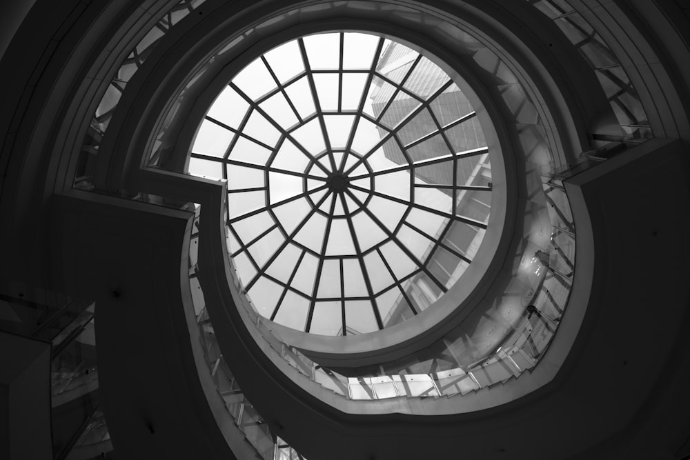 low-angle photo of clear glass ceiling