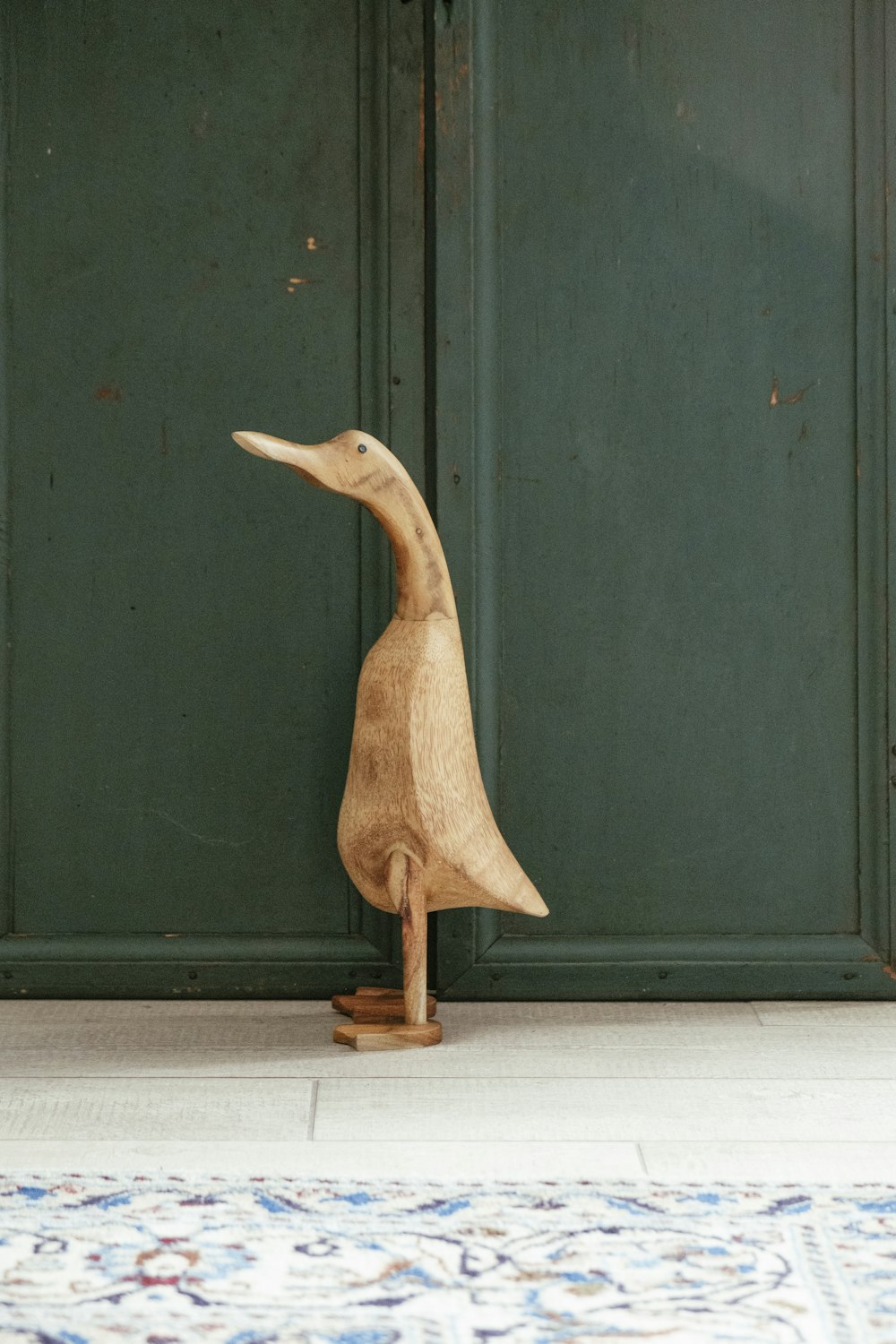 brown wooden duck figurine