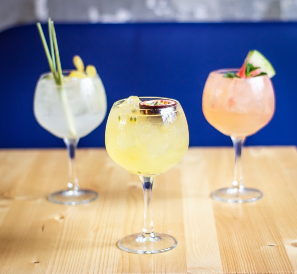 three clear drinking glass on table