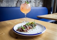 meat dish on white and blue plate