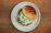 Close-up of a golden, toasted club house sandwich with fresh ingredients spilling out.