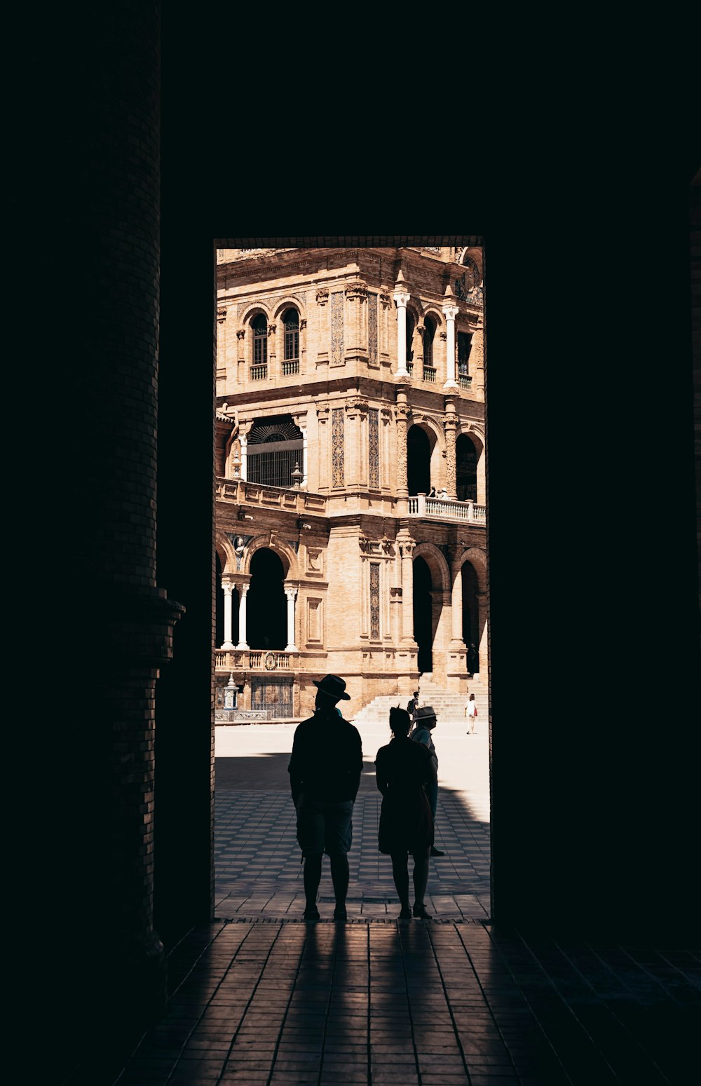 silhouette of people near door