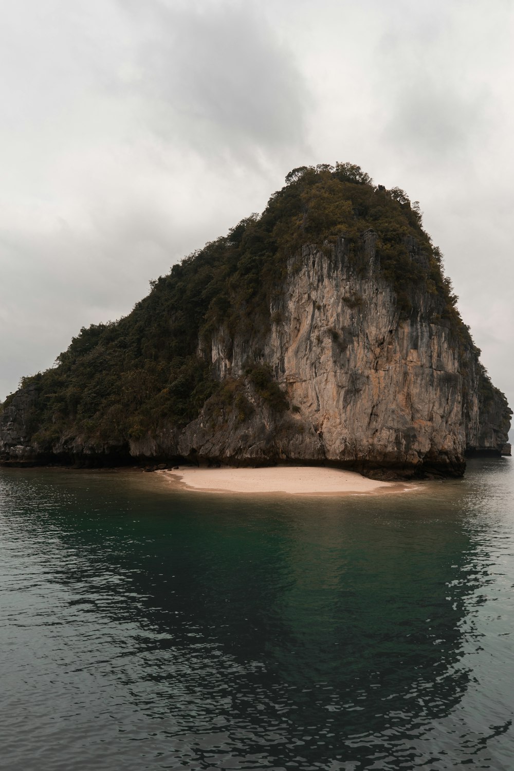 brown rock formation on water