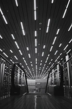 grayscale photo of escalator