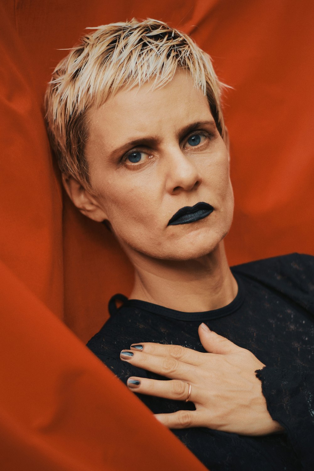 woman wearing black shirt and black lipstick