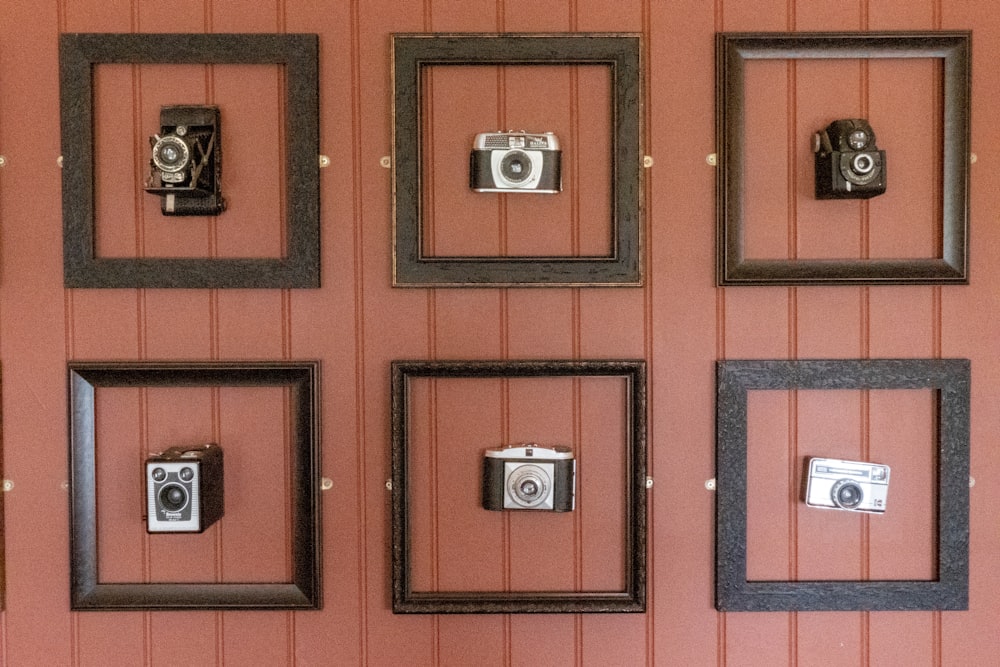 six assorted type of camera wall decors