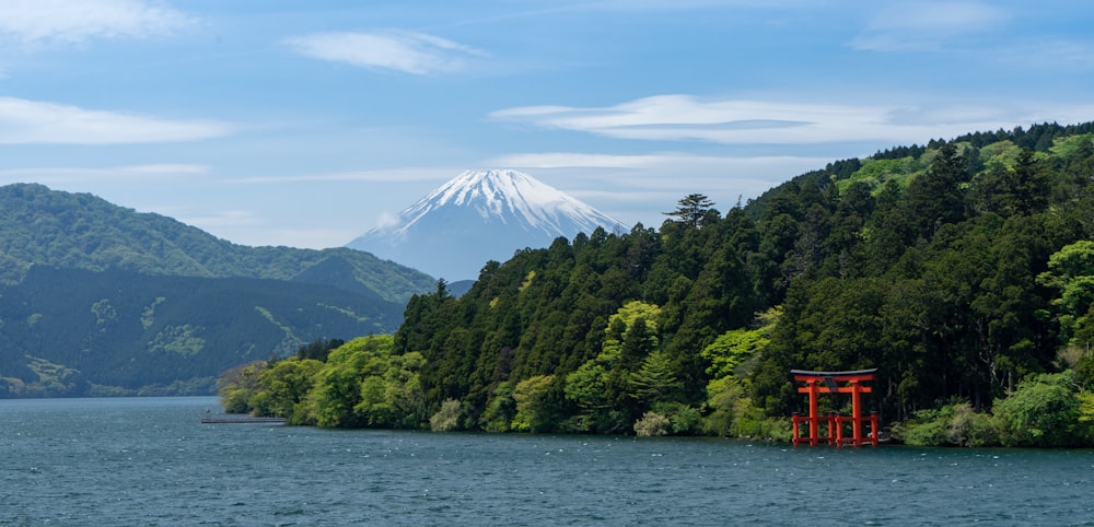 red pagoda temple on body of water