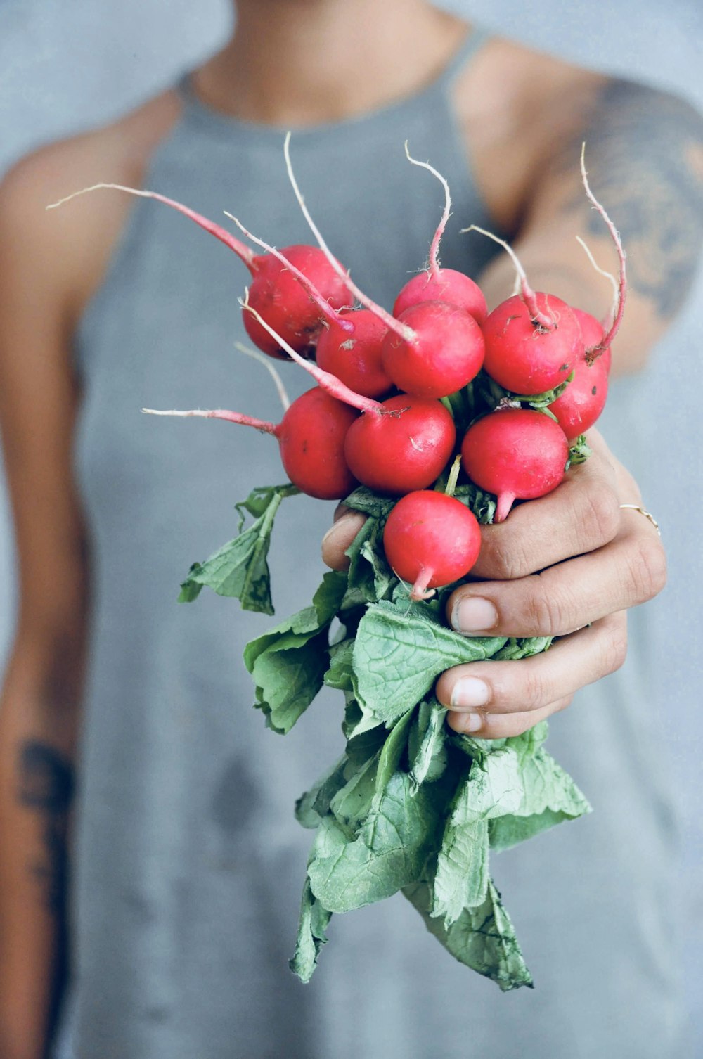 woman holding horseradish