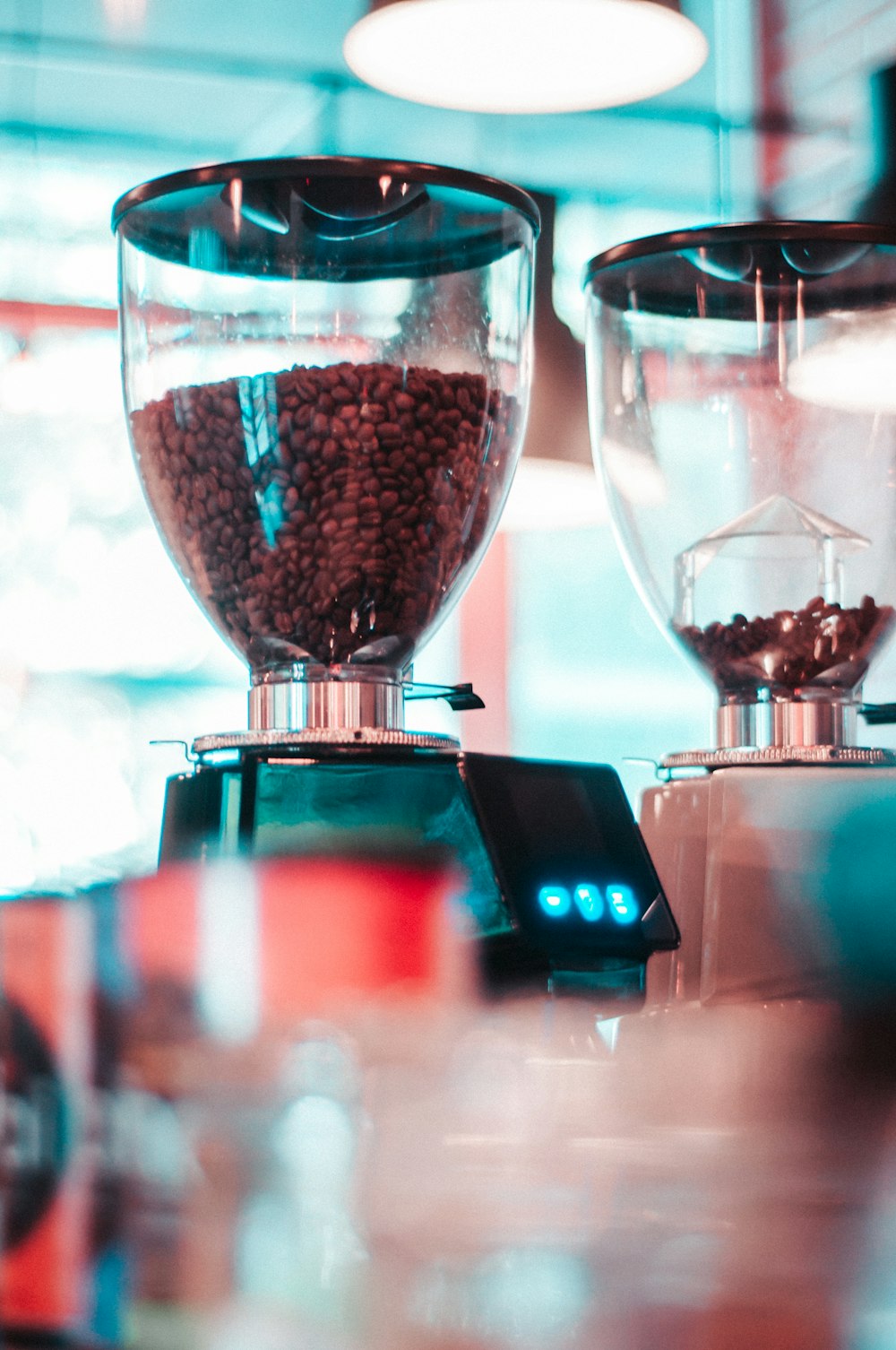 selective focus photography of coffee filled dispenser