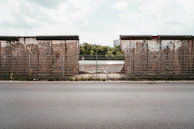 grey metal fence at the other side of the road