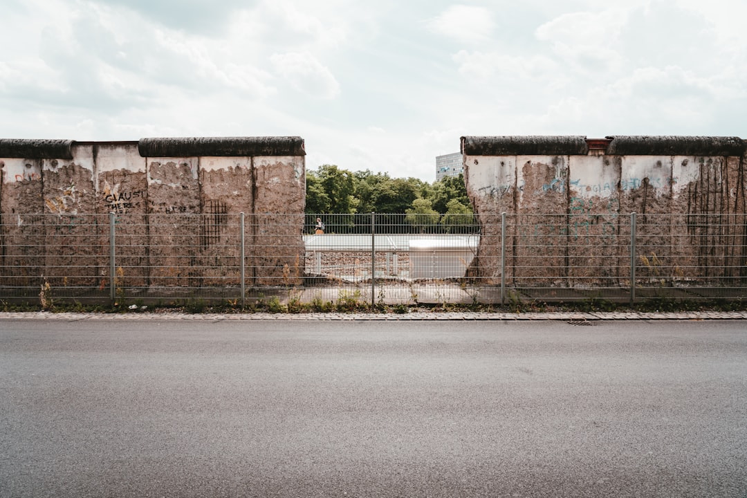 grey metal fence at the other side of the road