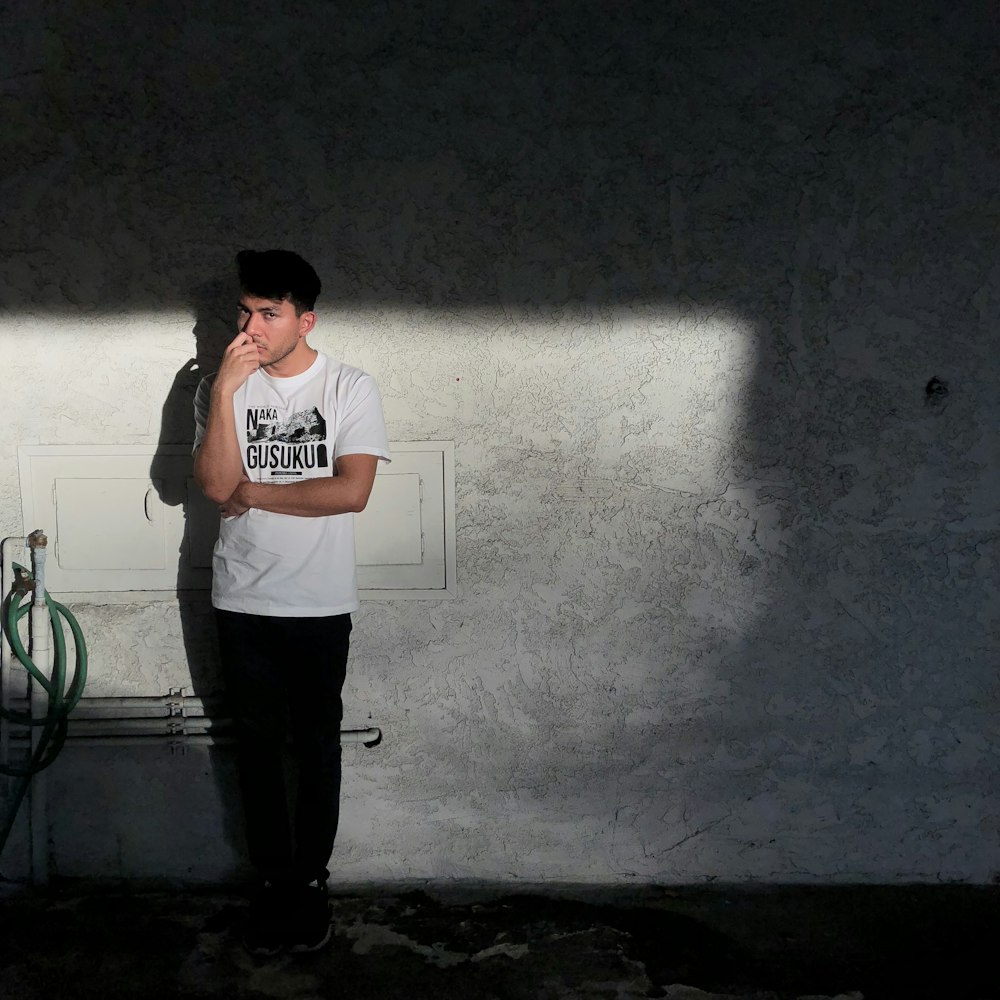 man standing near wall