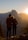 A couple exploring a scenic mountain landscape together.