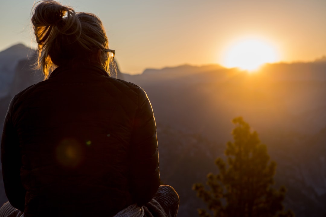 woman looking at sunrise