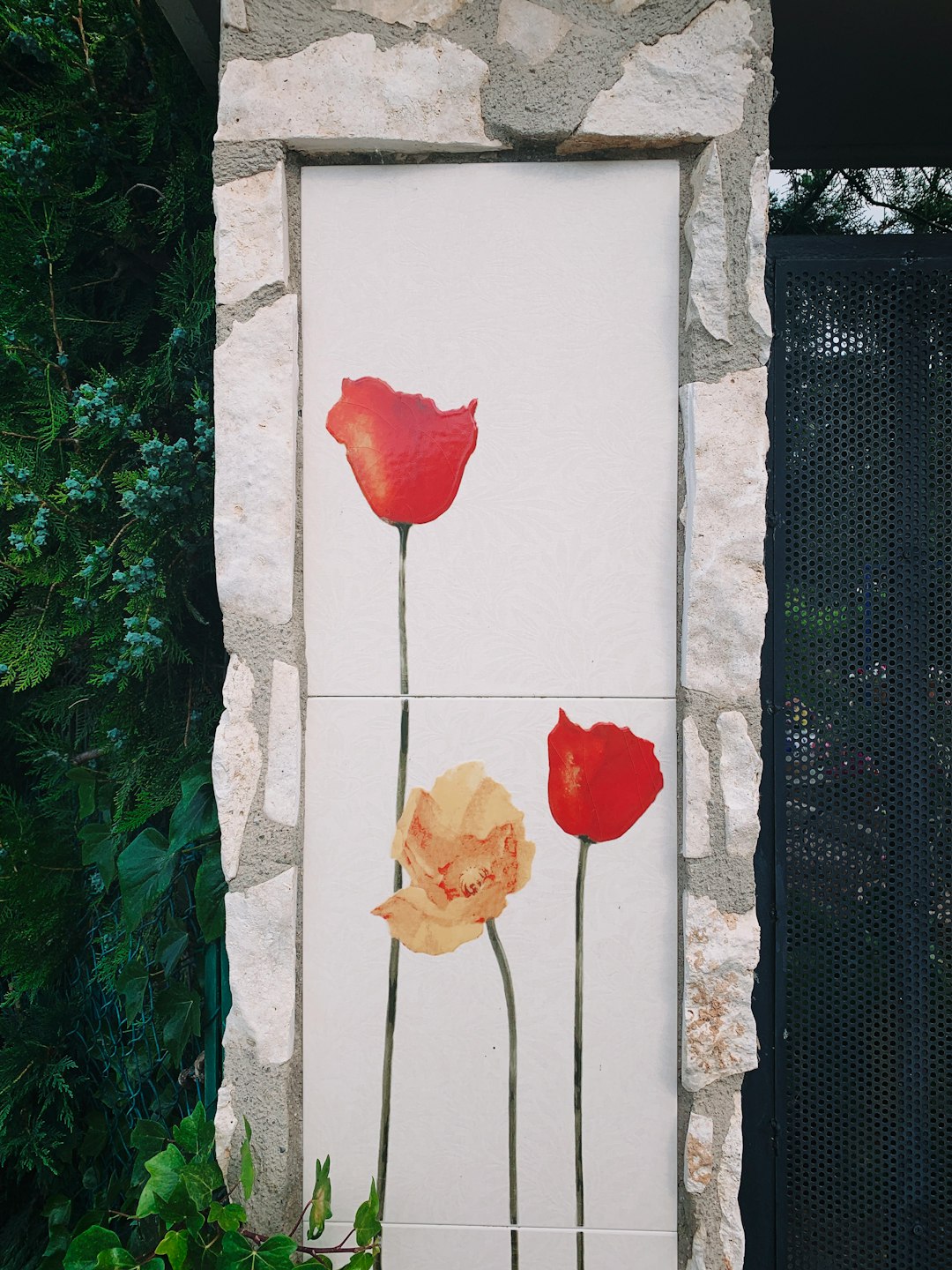 poppy flower painted tiles on wall
