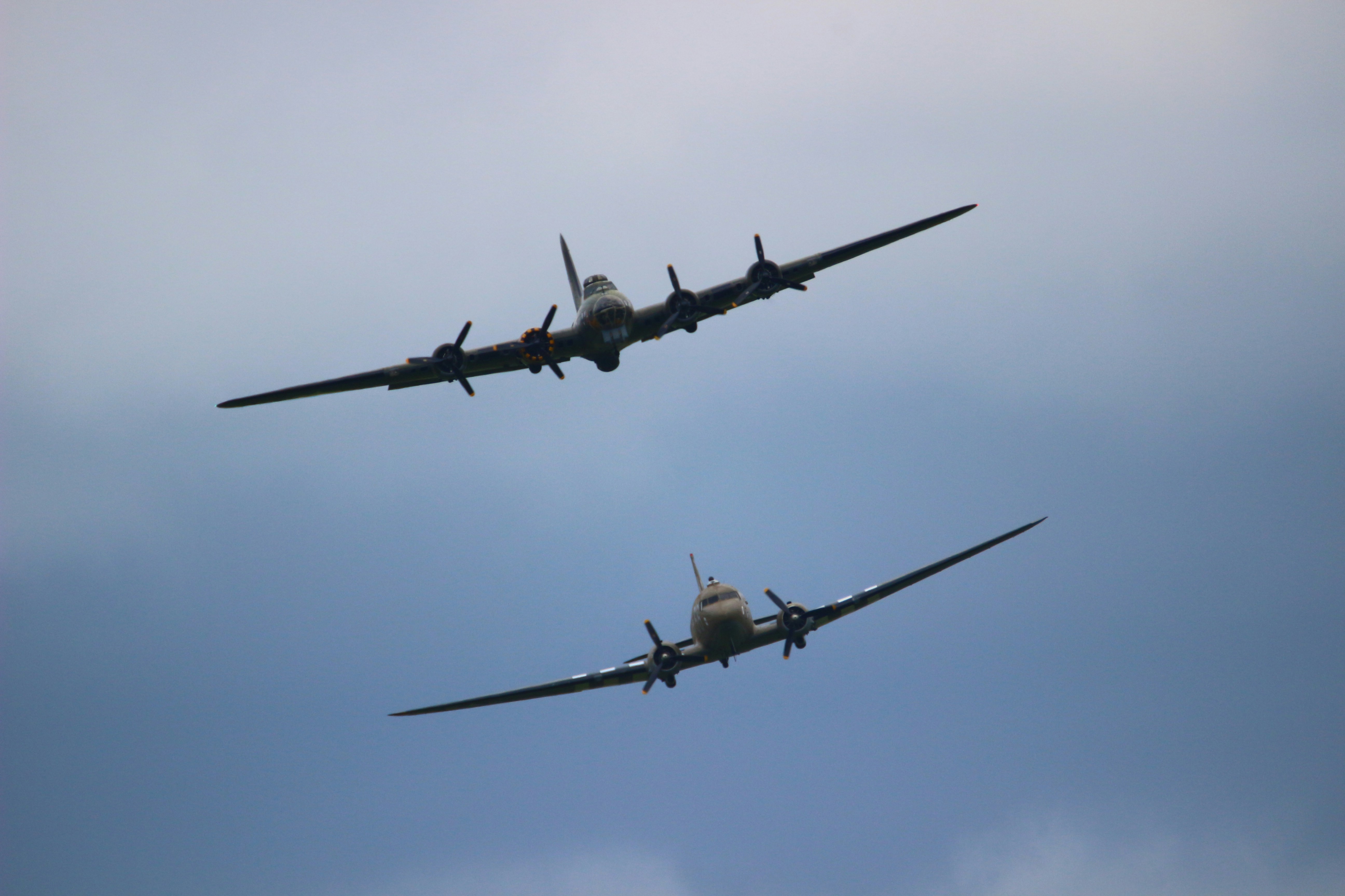 two gray airplanes in air during daytime, 