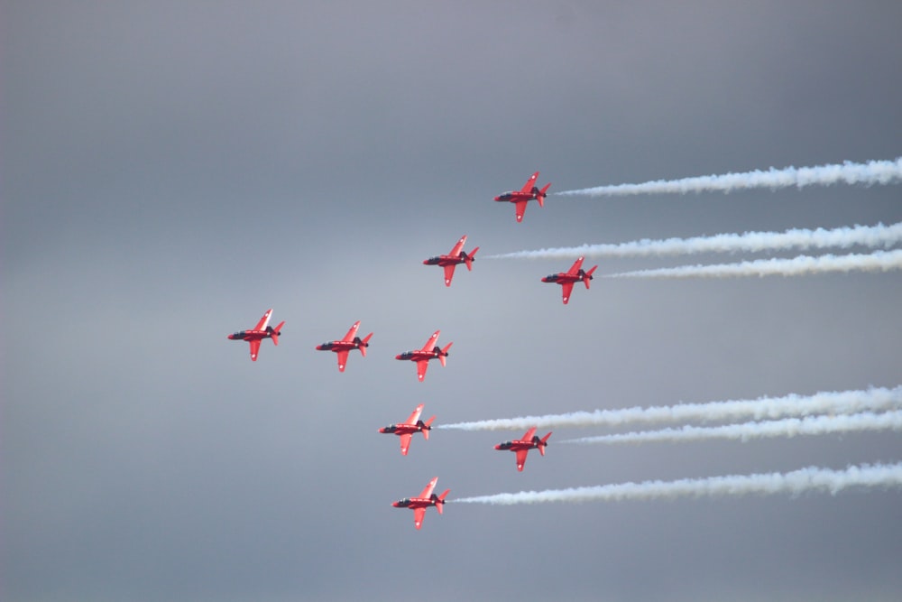 several jet planes performing in sky