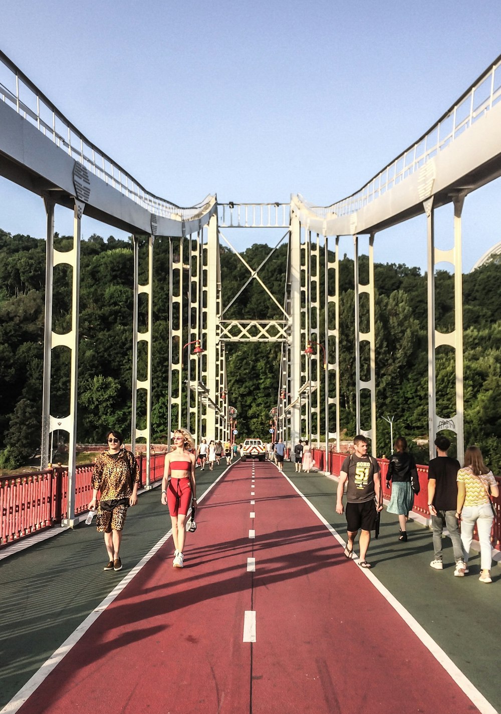 people walking on bridge