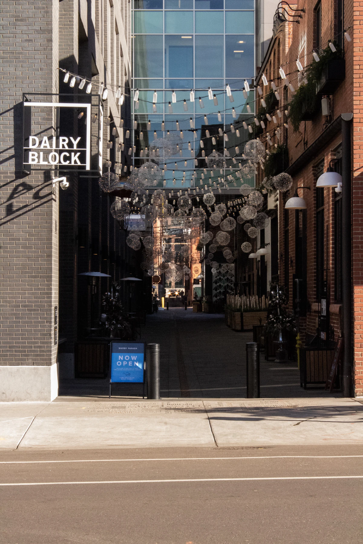 Dairy Block alley illuminated by hanging lights