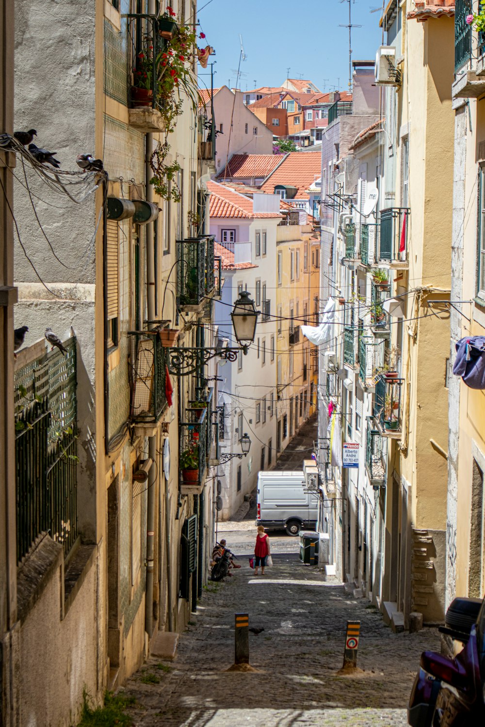 person standing in building alley