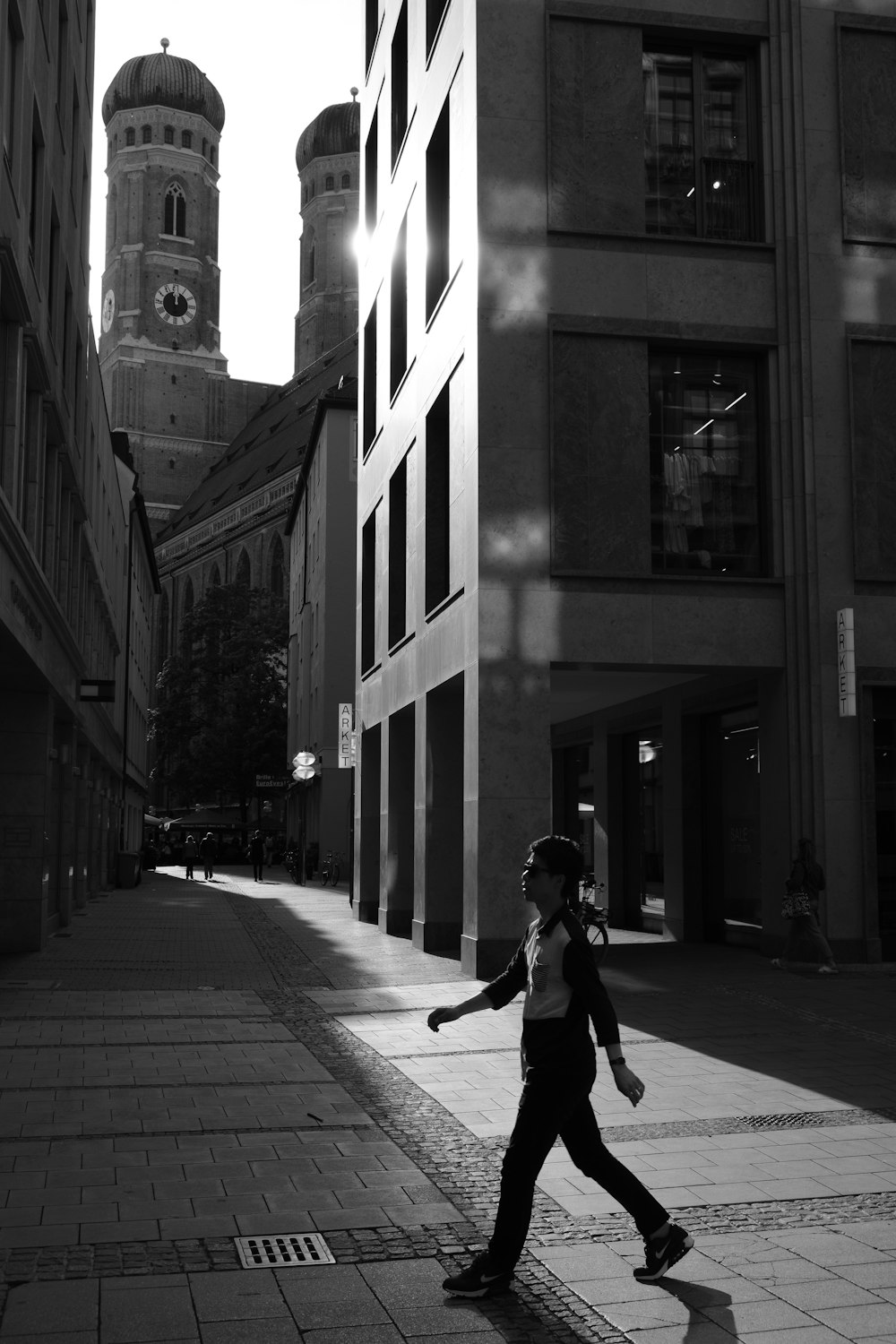 man walking near buildings