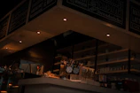 A cozy café interior with soft ambient lighting and subtle background music playing