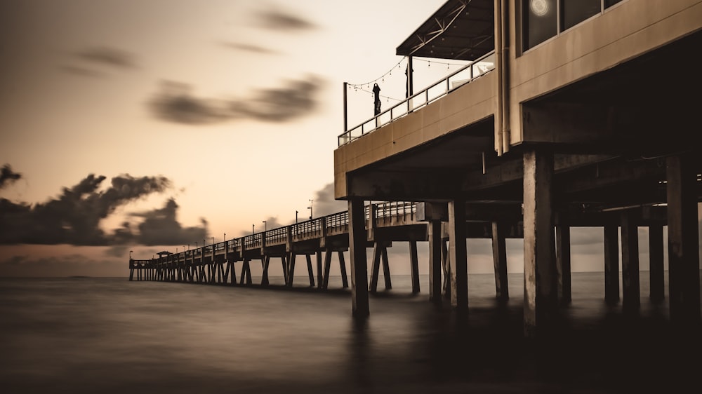 silhouette photo of concrete dock