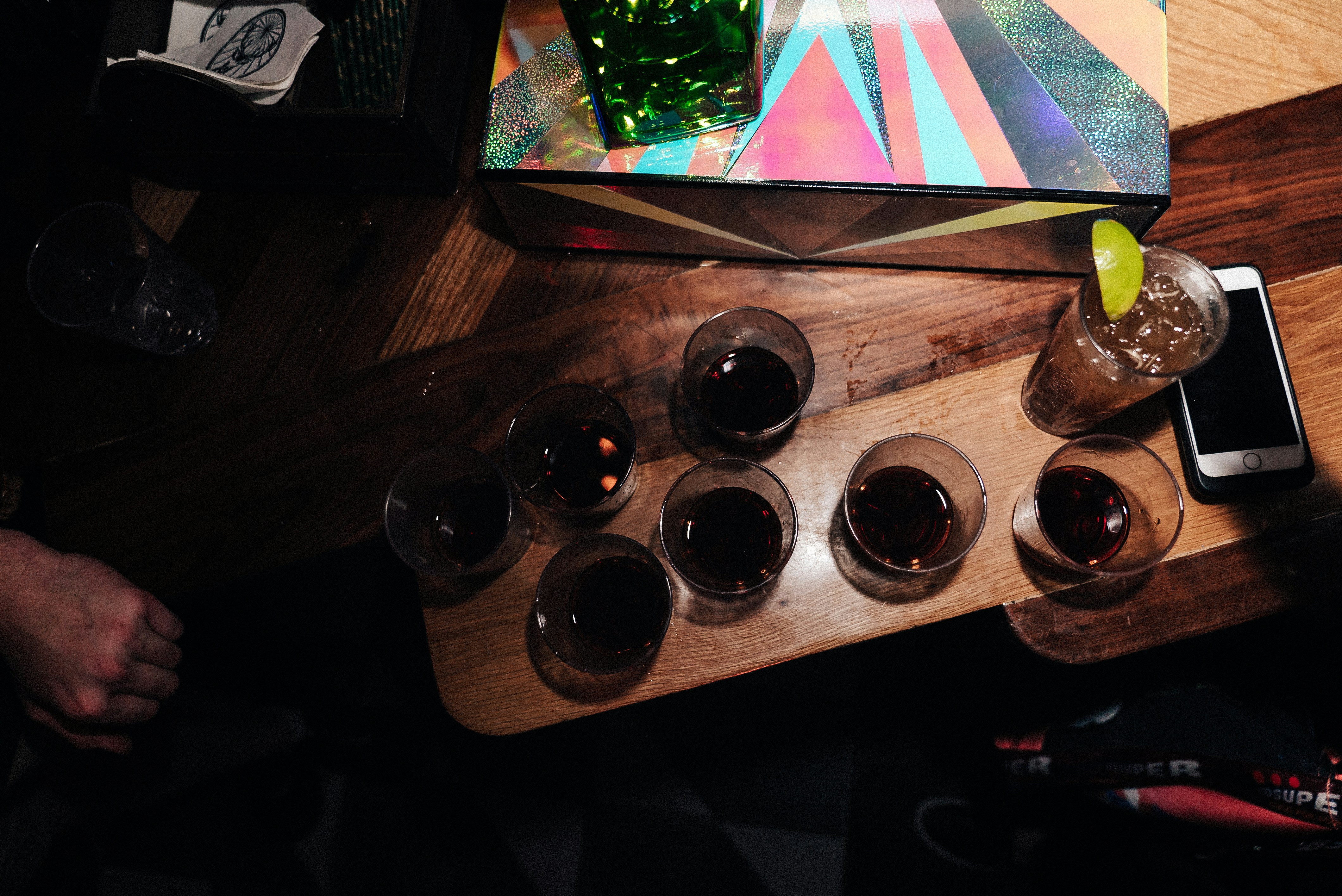 half-filled shot glasses on table