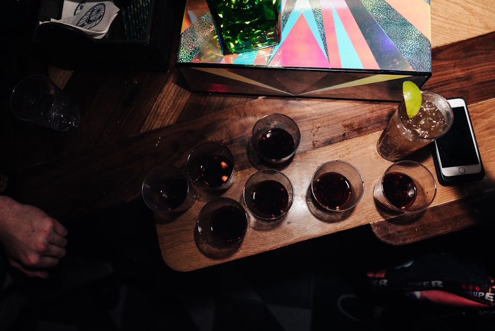 half-filled shot glasses on table