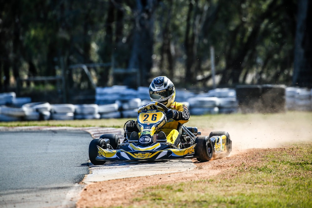 man in yellow go-kart