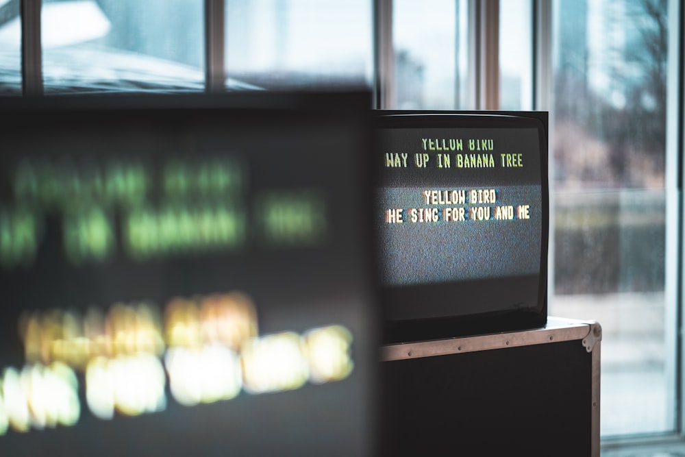 selective photo of flat screen monitor displaying text