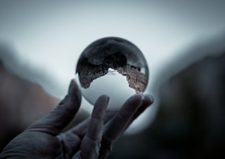 reflection of landscape in clear glass ball