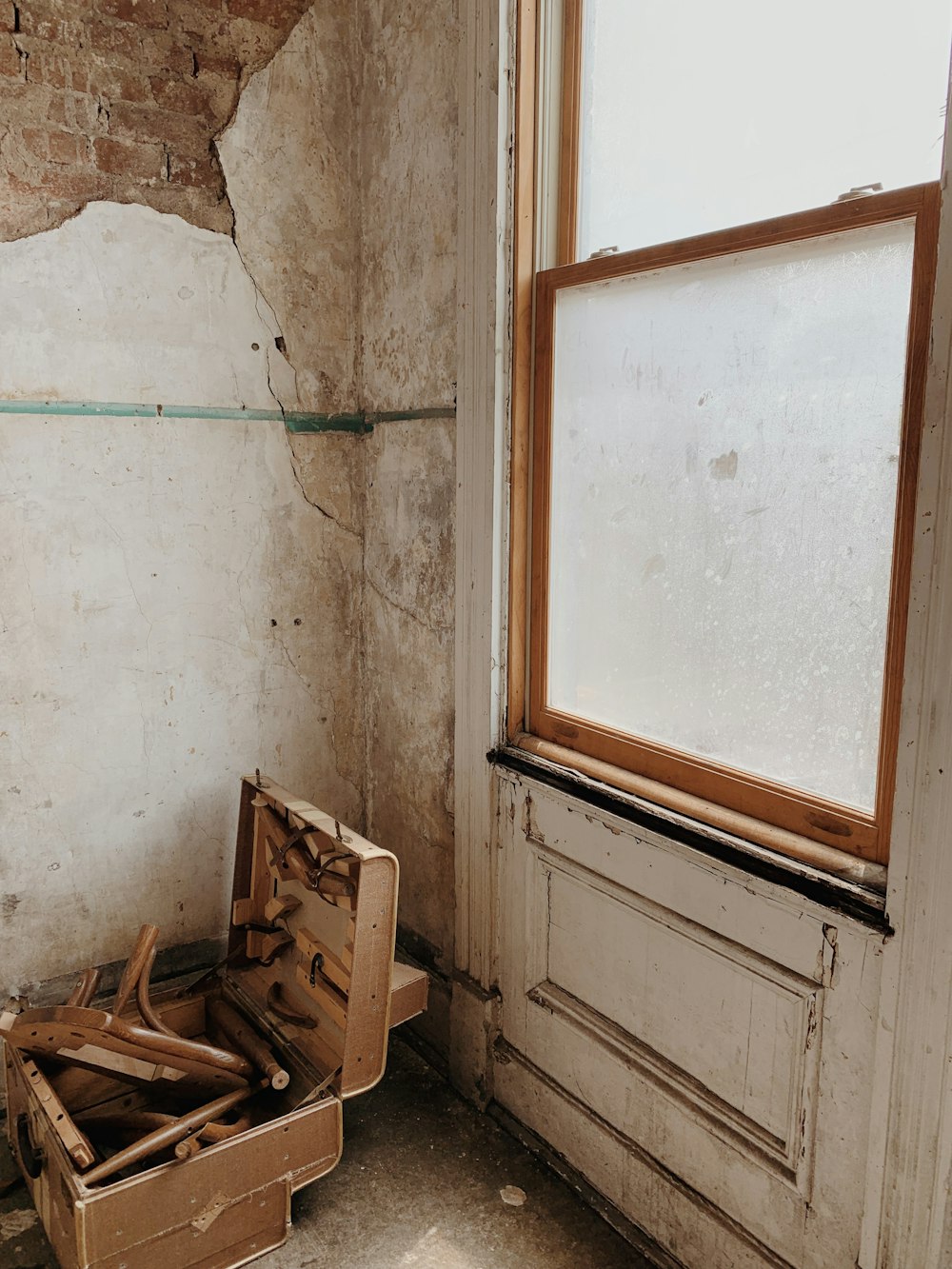 brown wooden framed frosted glass window panel