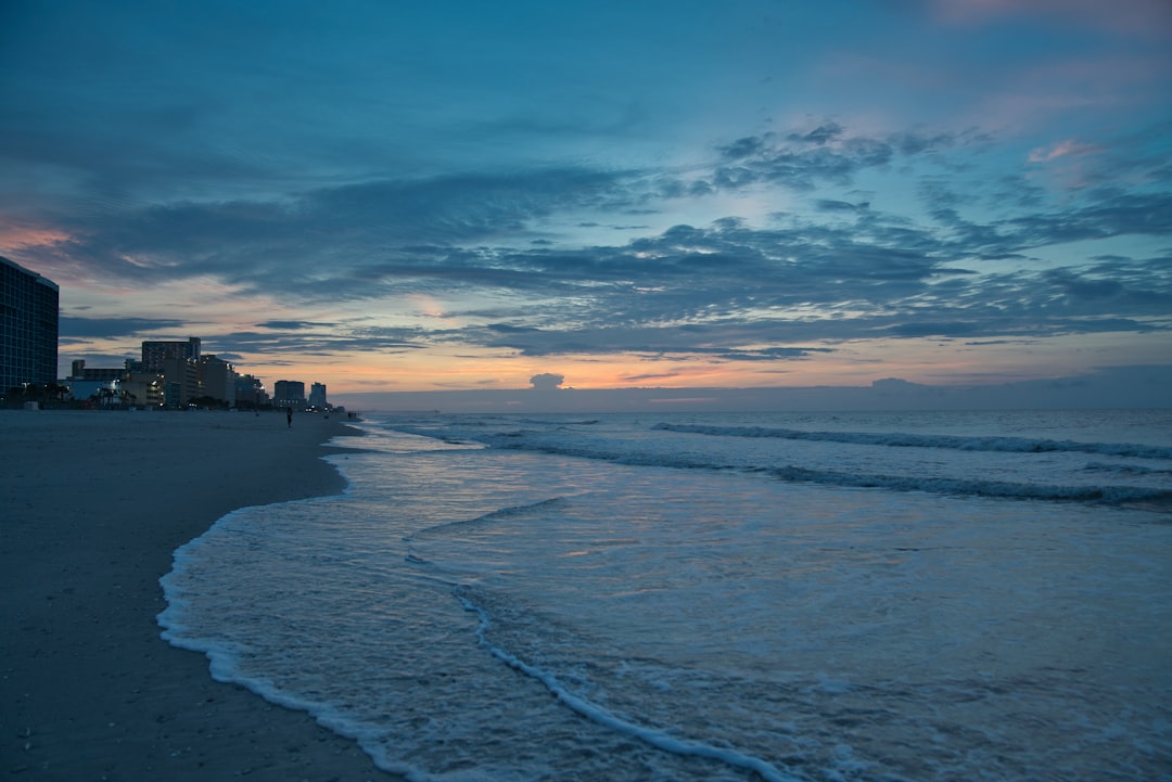 orange and blue sky at sunset over beach