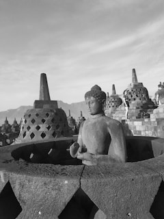 grayscale photo of Buddha statue