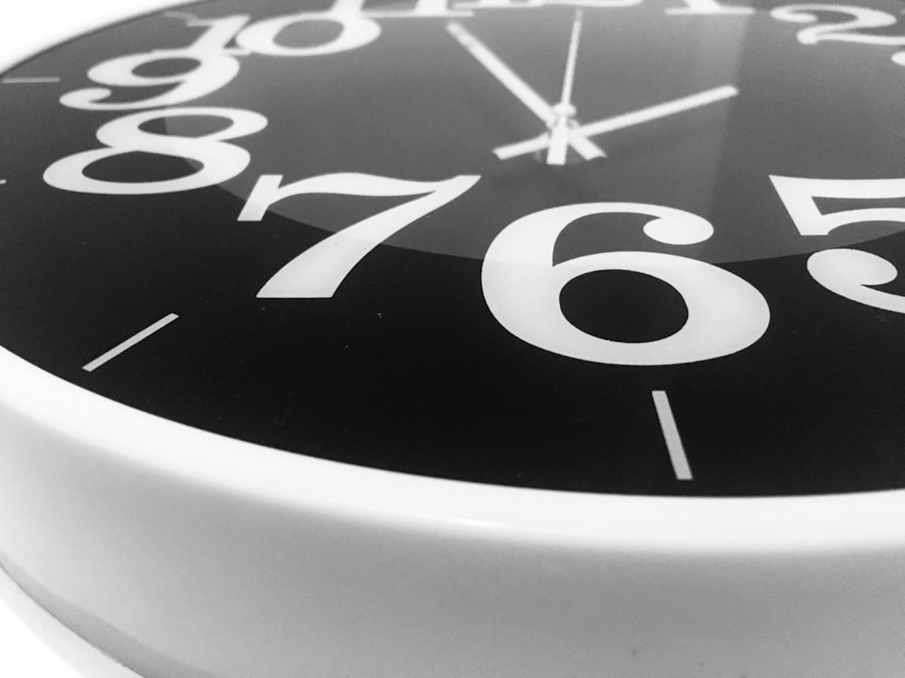 black and white analog wall clock