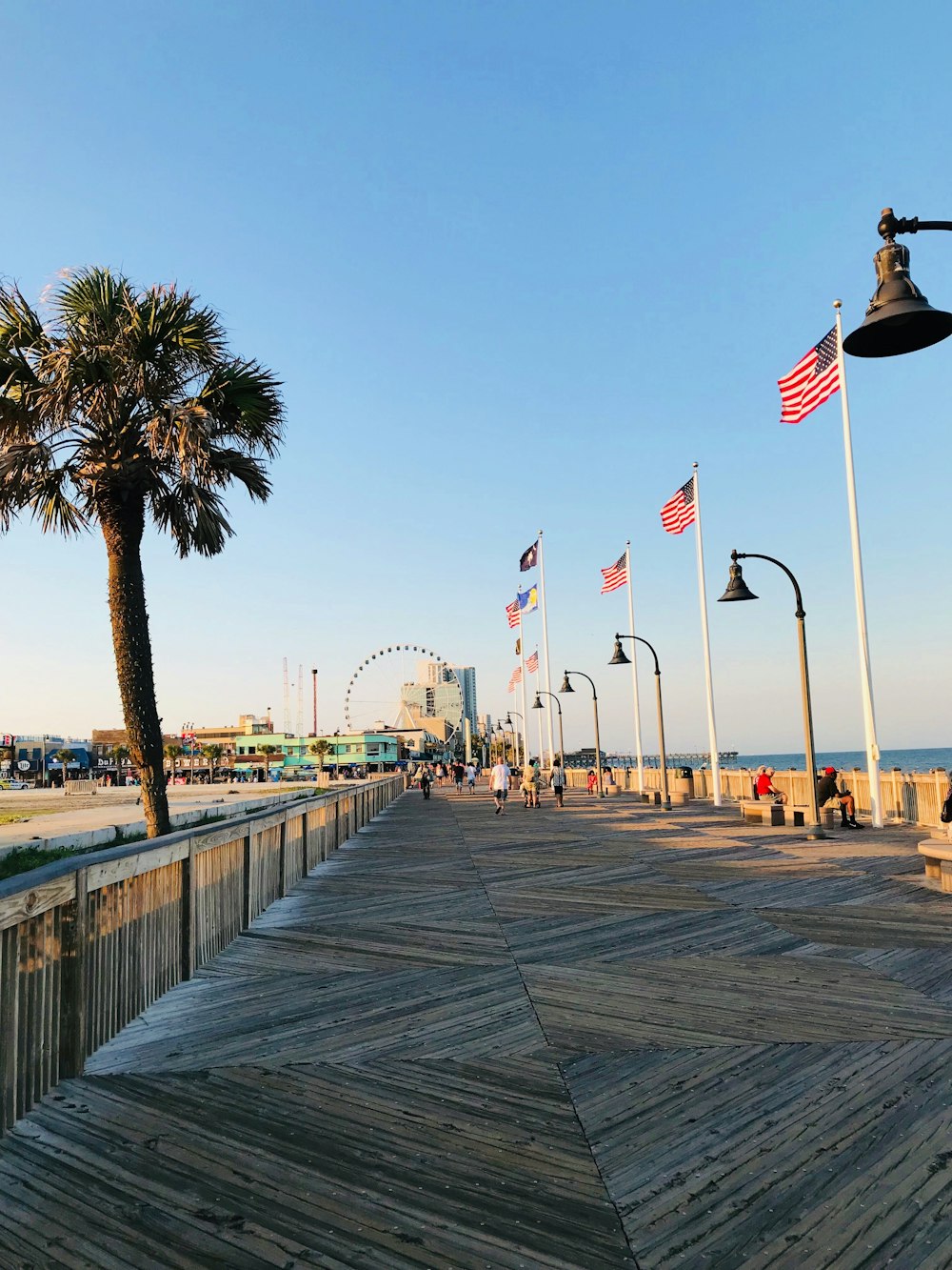 people walking beside flags