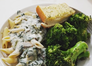 bread, pasta and broccoli in plate