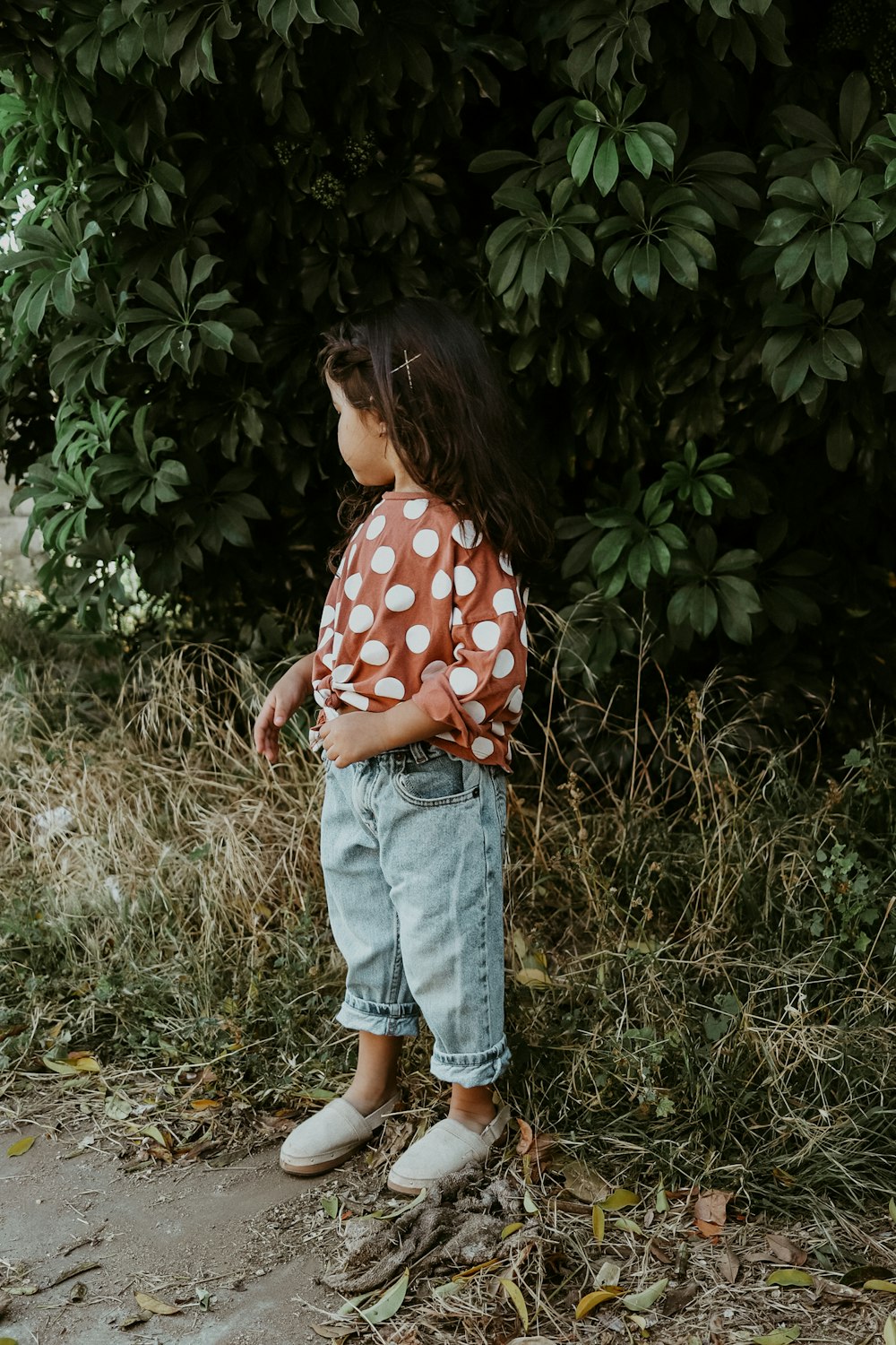 girl in red and white polka dot shirt