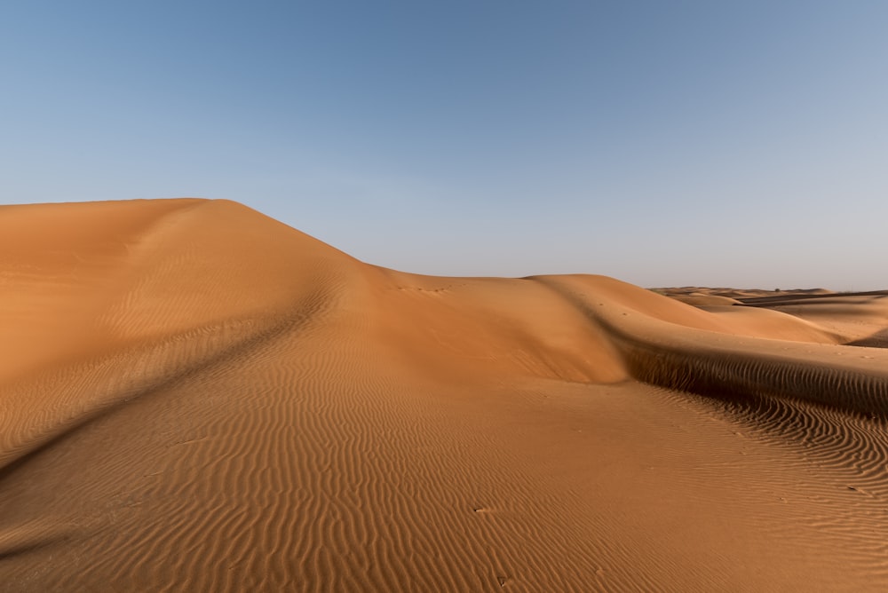 brown sand dune in desert