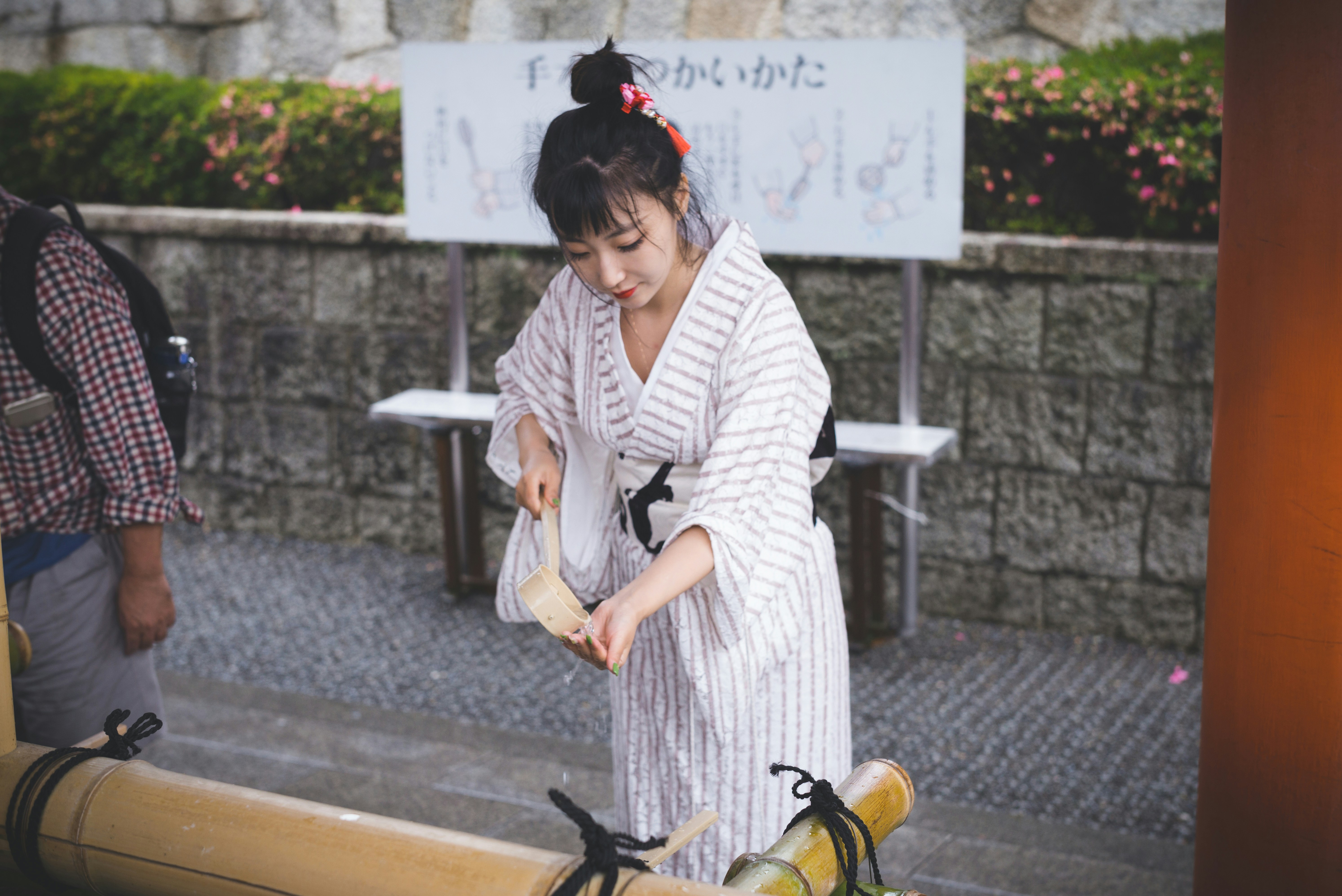 Person performing 'Drop, Cover, Hold On' under a table during an earthquake