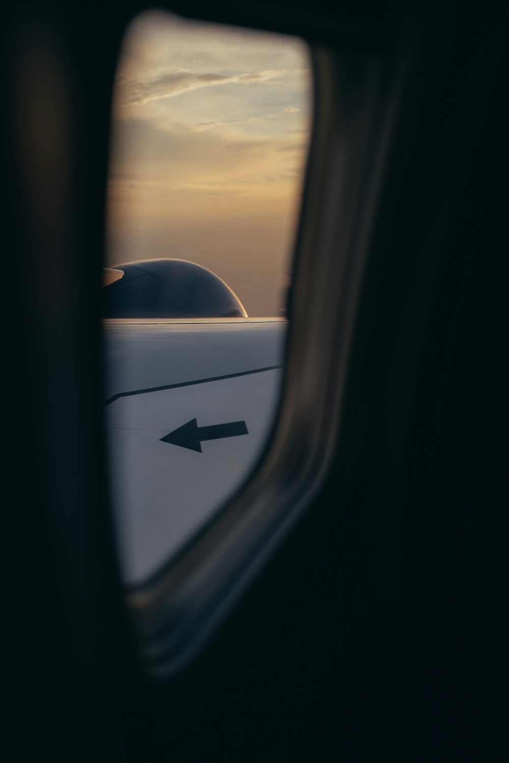 a view of the wing of an airplane through a window