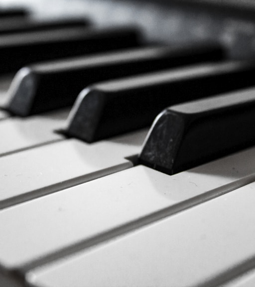 grayscale photography of piano