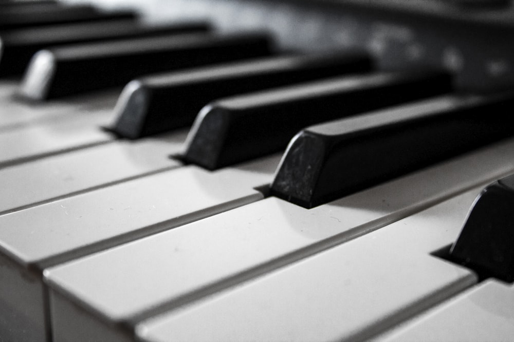 grayscale photography of piano