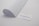 A minimalistic scene with a curved sheet of white paper positioned next to a business card. The business card displays a motivational quote in blue text: 'If you can design one thing, you can design everything.' The card rests on a plain light grey surface.