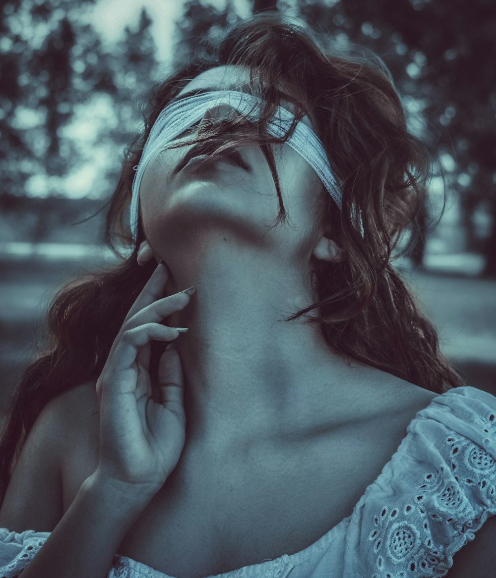 Woman with blindfold touching her neck photo – Free Woman Image on ...